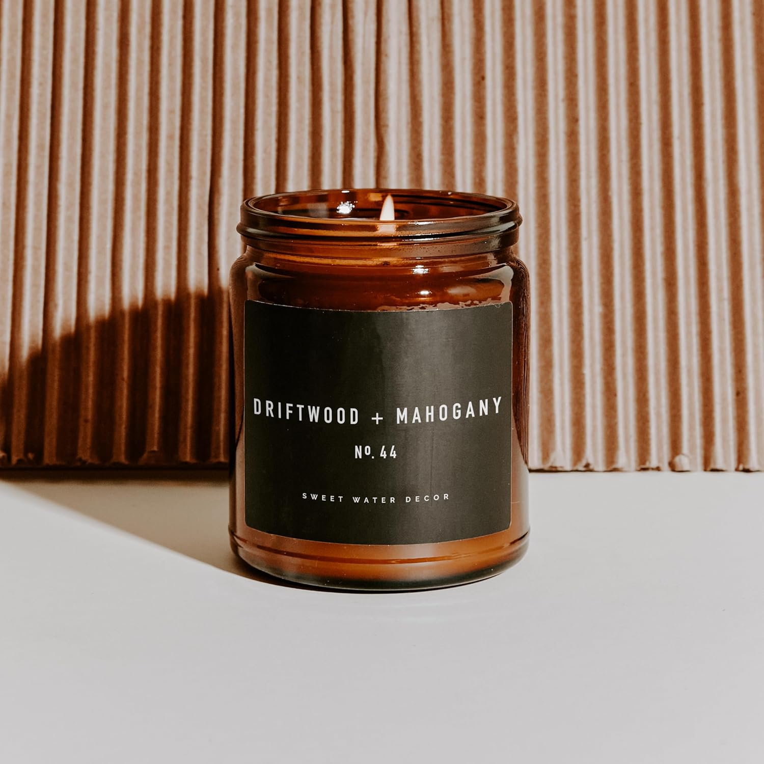 Sweet Water Decor Candle in Mahogany and Wood Scent
